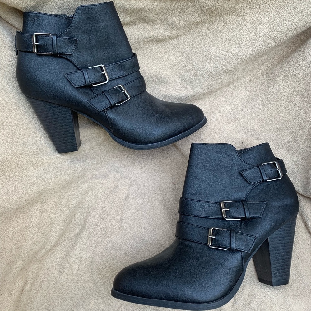 Black leather ankle boots with buckle detail